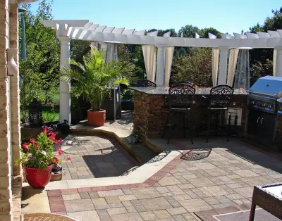 Backyard Oasis in Bath, Ohio — Stone & Concrete Installation project by Land Creations Landscaping Inc.