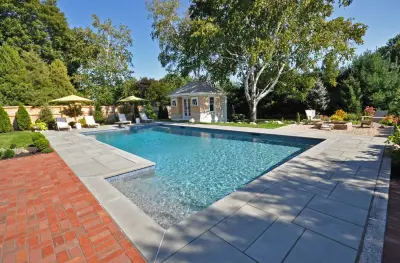 Stunning Pool with Bluestone Deck by Swenson Granite Works