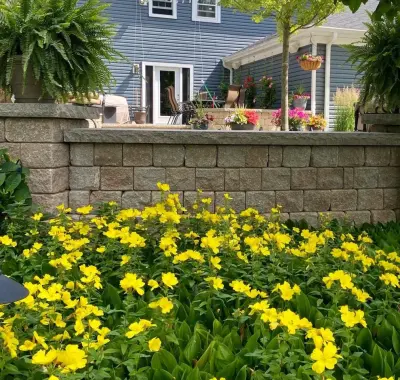 Flourishing Garden — Stone & Concrete Installation project by Land Creations Landscaping Inc.