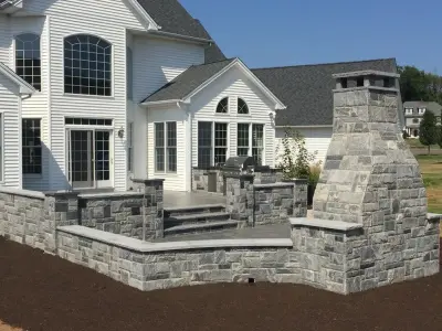 Cheshire, CT Custom Stone Patio Featuring Built-in Fireplace — Stone & Concrete Installation project by F.K. Masonry