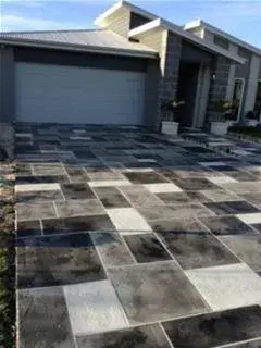 Custom Artistic Driveway Design — Stone & Concrete Installation project by JADE Epoxy Flooring Company