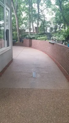 Aggregate patio with brick edging — Stone & Concrete Installation project by Moser Contracting