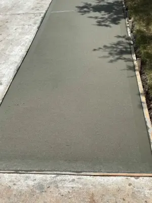 Sidewalk and Driveway Extension — Stone & Concrete Installation project by Flores Concrete