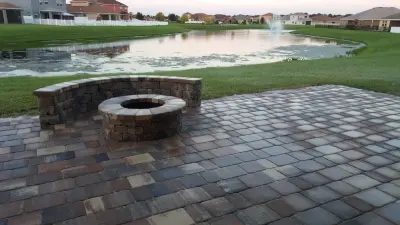 Outdoor Fireplace and Bench Seating — Stone & Concrete Installation project by JR Pavers Inc.
