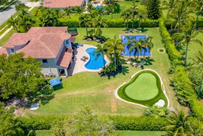 PRIVATE BACKYARD CELEBRITY GREENS PUTTING GREEN by The Landscaping People, Inc.