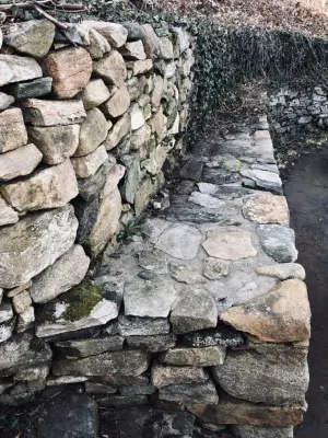 Robust Dual-Tier Retaining Wall — Stone & Concrete Installation project by Hefel Masonry LLC