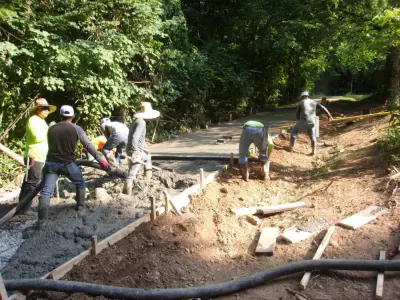 Central Driveway Renewal and Rip Rap Drainage — Stone & Concrete Installation project by The Concrete Gentlemen, LLC