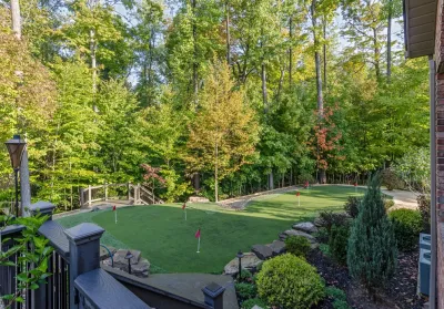Backyard Renovation: Pool, Patio, Kitchen, Firepit & Golf — Landscape Construction project by The Ohio Valley Group, INC. in North Royalton