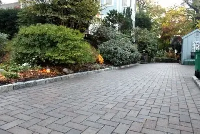2015 Unilock Best Permeable Paver Driveway Award Winner - Newton, MA — Stone & Concrete Installation project by Premier Pavers & Hardscape Co