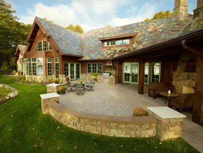 Northern Getaway: Paver driveway; patio with independent wall — Stone & Concrete Installation project by Anchor Block Company