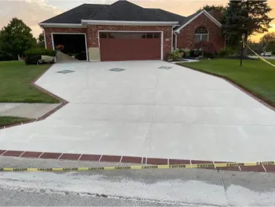 Driveway Signature System — Stone & Concrete Installation project by Decorative Concrete Resurfacing