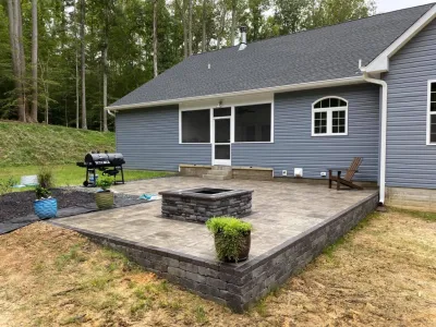 Raised Patio with Firepit — Landscape Construction project by The Outdoor Living Company