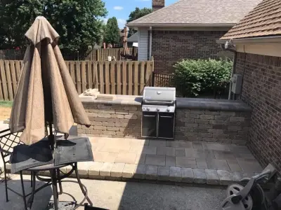 Elevated Patio and Fire Pit Outdoor Bar Area — Stone & Concrete Installation project by Advanced Grounds Maintenance, LLC