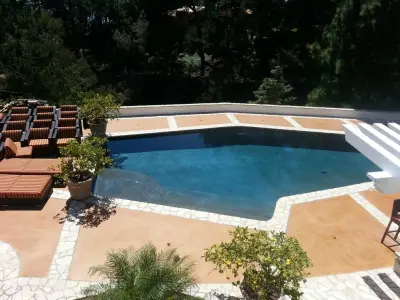 Palo Verdes Peninsula Swimming Pool Deck — Stone & Concrete Installation project by Modern Concrete Surfaces