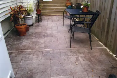 Patio: layered, etched, patterned, and dyed — Stone & Concrete Installation project by Green Orleans Concrete Designs