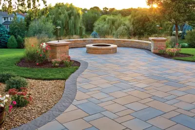 Charming Outdoor Space: Paver patio featuring a fire pit and seating wall — Stone & Concrete Installation project by Anchor Block Company