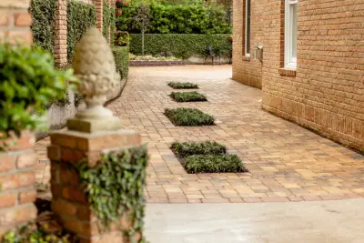 Paver Driveway and Courtyard at Piping Rock — Stone & Concrete Installation project by NeSmith Landscapes