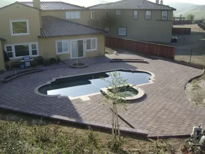 Swimming Area Patios — Stone & Concrete Installation project by Integrated Paver Systems