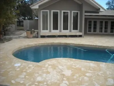 Swim Area Patios — Stone & Concrete Installation project by Celtic Pavers