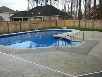 Swimming Pool Patios — Stone & Concrete Installation project by Muddman Concrete Services, Inc.