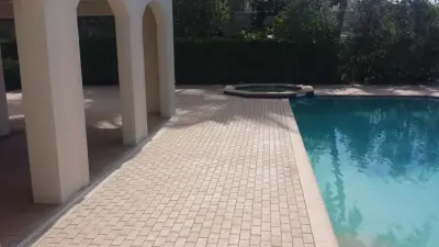 Swimming Area Patios — Stone & Concrete Installation project by Island Exteriors, LLC