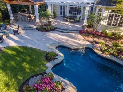 Outdoor Living Area with Pool and Patio — Stone & Concrete Installation project by Cambridge Pavingstones With ArmorTec