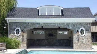 Backyard Oasis with Kitchen and Pool House by Premier Home Services, Inc