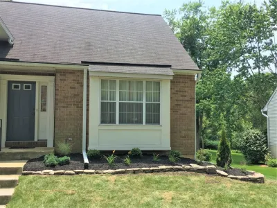 Simple planting and stone wall — Landscape Construction project by Valley Deck & Patio in Ellicott City