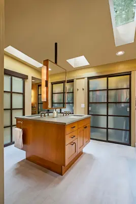 Roomy Primary Bathroom by Angelini And Associates Architects