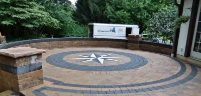 Compass Inlay Patio and Water Feature by Weavers Landscape Company