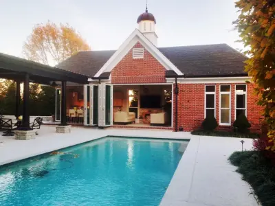 St. Louis AT HOME Magazine: "Outdoor Living" - Pool House in Frontenac, MO by FORNEY + Architecture, LLC