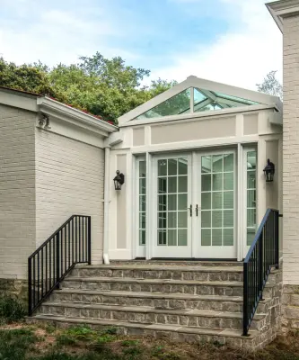 Glass-roofed sunroom enclosure by Noble Architects, LLC