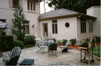 Transforming a screened porch into a cozy family room by Paradigm Architecture Design & Consulting
