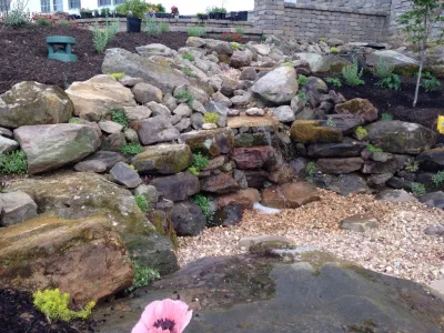 Top rock pondless waterfeature — Landscape Construction project by Winland's Complete Landscaping Service