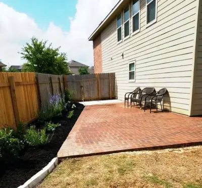 South Austin Patio Expansion with Pavers and Flower Beds — Stone & Concrete Installation project by BioScapes LLC