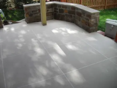 Expansive Paved Tile Design with Spray Finish — Stone & Concrete Installation project by Elite Concrete Design