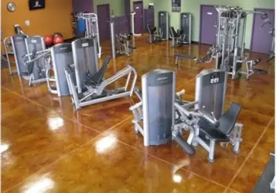 Fitness Room with Stained Concrete — Stone & Concrete Installation project by JADE Epoxy Flooring Company