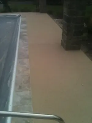 Textured Spray Finish on Stamped Stone Pool Coping and Deck — Stone & Concrete Installation project by Elite Concrete Design