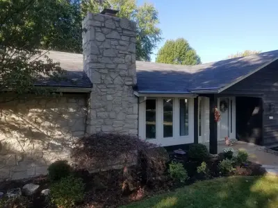 Tuck-pointing stone chimney in Ballwin, Missouri — Stone & Concrete Installation project by Masterpiece Masonry