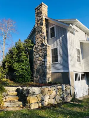 Veneered Stone Chimney — Stone & Concrete Installation project by Hefel Masonry LLC