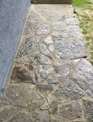 Flagstone sidewalk — Landscape Construction project by Zach's Lawn & Landscaping