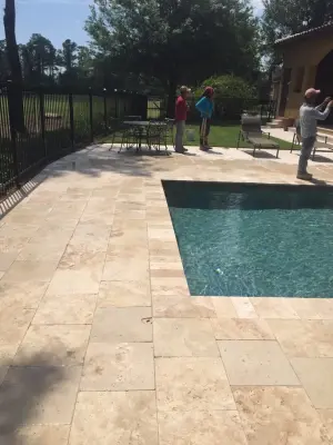 Keene's Point Travertine Pool Deck — Stone & Concrete Installation project by JR Pavers Inc.
