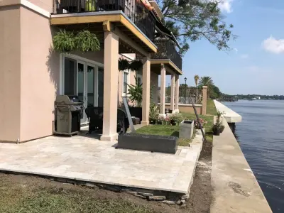 Travertine River Road — Stone & Concrete Installation project by Salt Run Outdoor