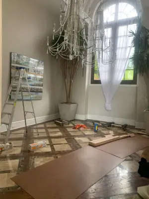 Wood flooring renovation and marble inlays modification by Fine Line Flooring Inc.