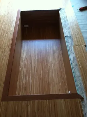 Hardwood flooring with a recessed Tatami table by Slaughterbeck Floors, Inc