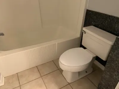 Osborn Bathroom Renovation for Guests — Flooring Installation Services project by Benchmark Renovations