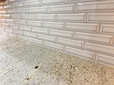 Beveled Subway Backsplash Installation — Flooring Installation Services project by Benchmark Renovations