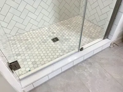 Tailored Shower Construction — Flooring Installation Services project by Benchmark Renovations