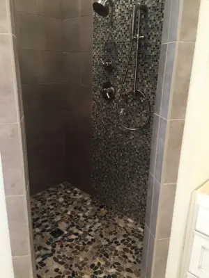 Pebble Bathroom Renovation — Flooring Installation Services project by D&D Floor Covering Inc