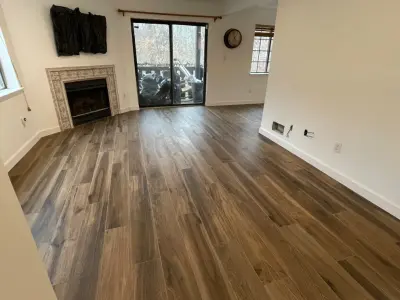 Wood-Look Floor Tiles - Apartment Renovation — Flooring Installation Services project by Floors By VAL